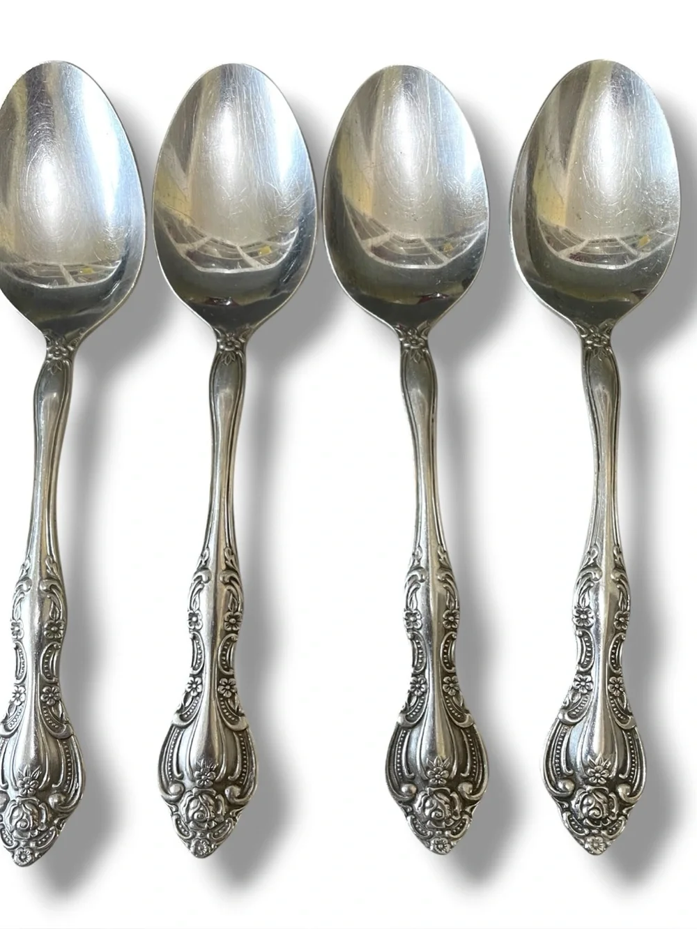 Imperial international /Oneida flatware, 4 spoons & 4 knives